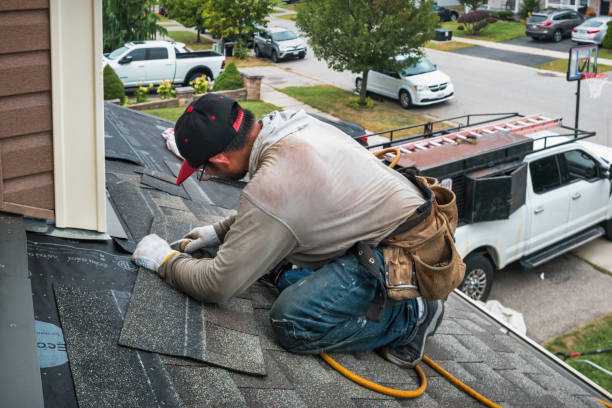Professional Storm Damage Roof Repair technician working in Clyde, NC